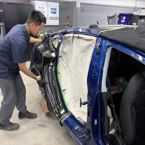 K.W. Auto Body Certified Tesla Repair Technicians K.W. Auto Body Certified Tesla Repair Technician working on car