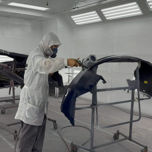 K.W. Auto Body Certified Tesla Repair Technician painting vehicle K.W. Auto Body Certified Tesla Repair Technician painting vehicle