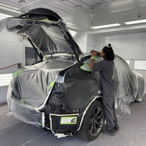 K.W. Auto Body Certified Tesla Repair Technician painting vehicle K.W. Auto Body Certified Tesla Repair Technician painting vehicle