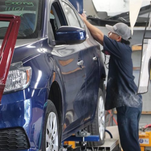 K.W. Auto Body Honolulu Repair Technician working on car repair