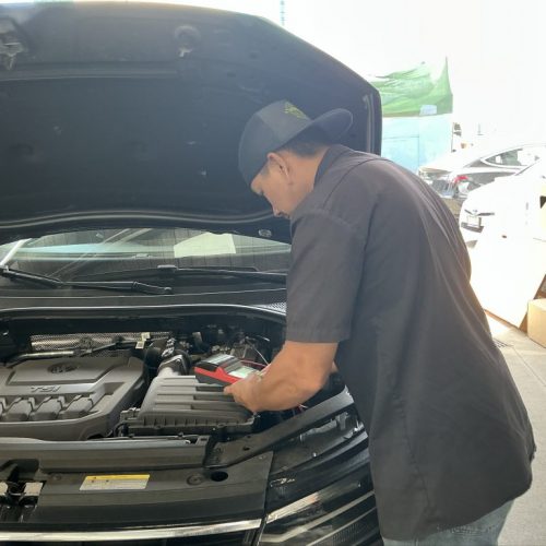 K.W. Auto Body Honolulu Repair Technician working on car