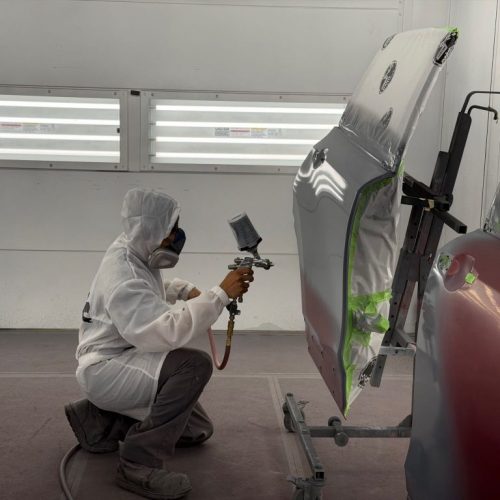 K.W. Auto Body Certified Tesla Repair Technician K.W. Auto Body Certified Tesla Repair Technician Painting Vehicle Door